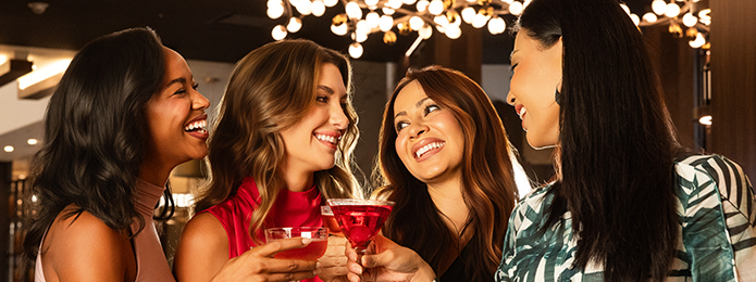 4 women toasting