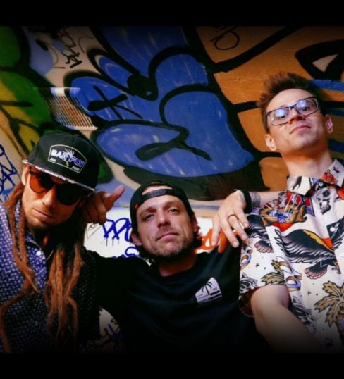 3 men standing in an alley