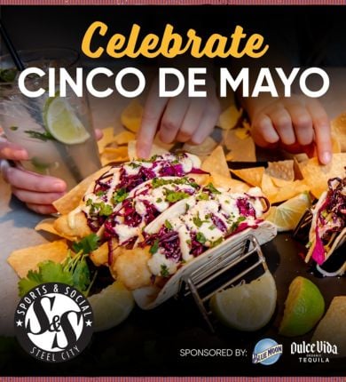 People reaching for tacos and nachos