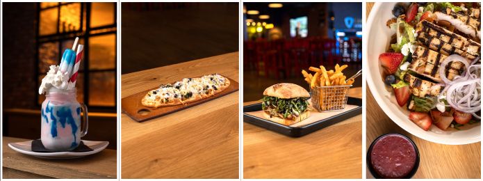 Milkshake, greek flatbread, berry salad, and chicken caprese sandwich