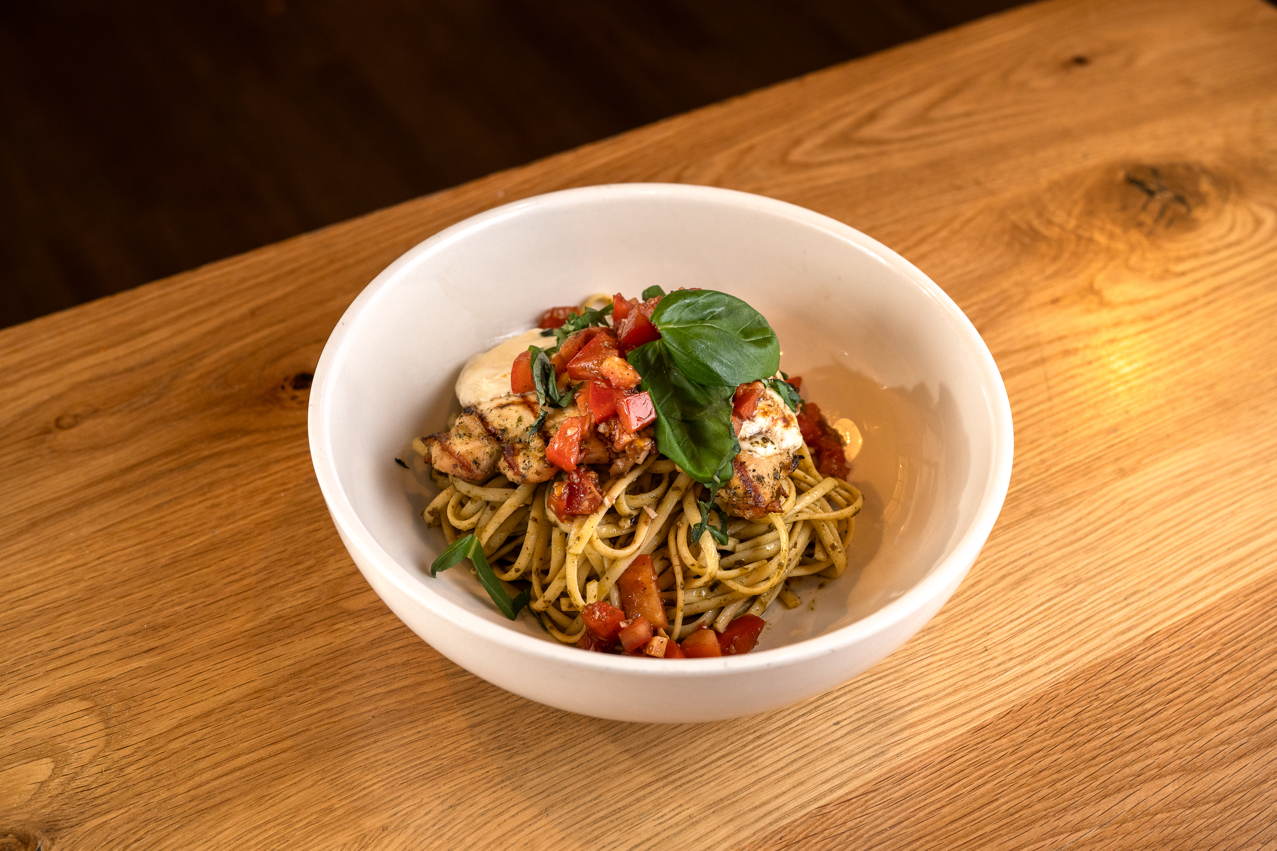 bruschetta chicken over pesto pasta