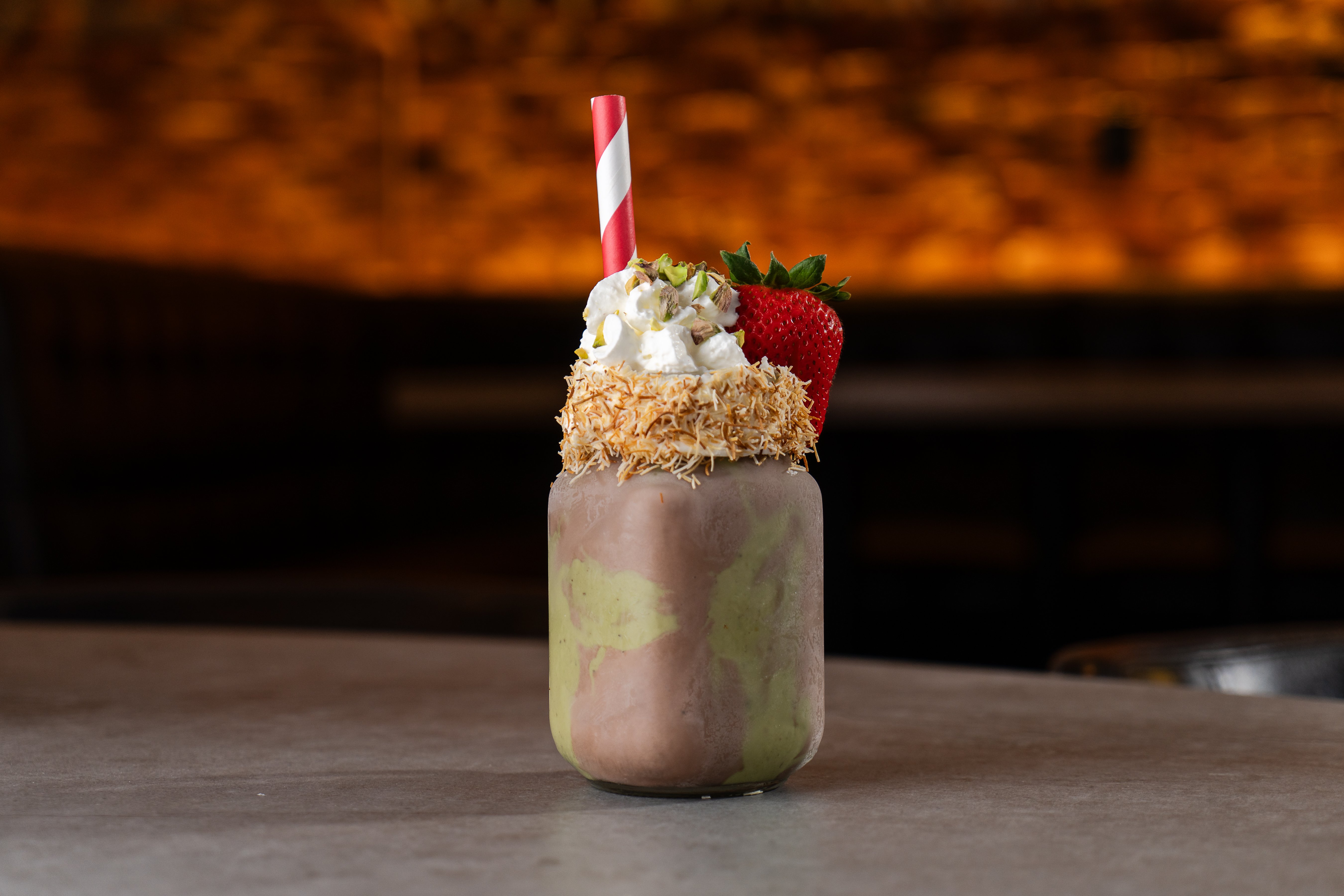 Strawberry milkshake with matcha and whip cream