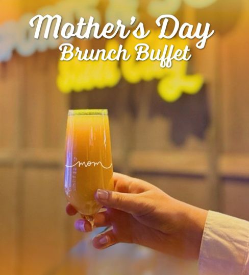 a lady holding a mimosa