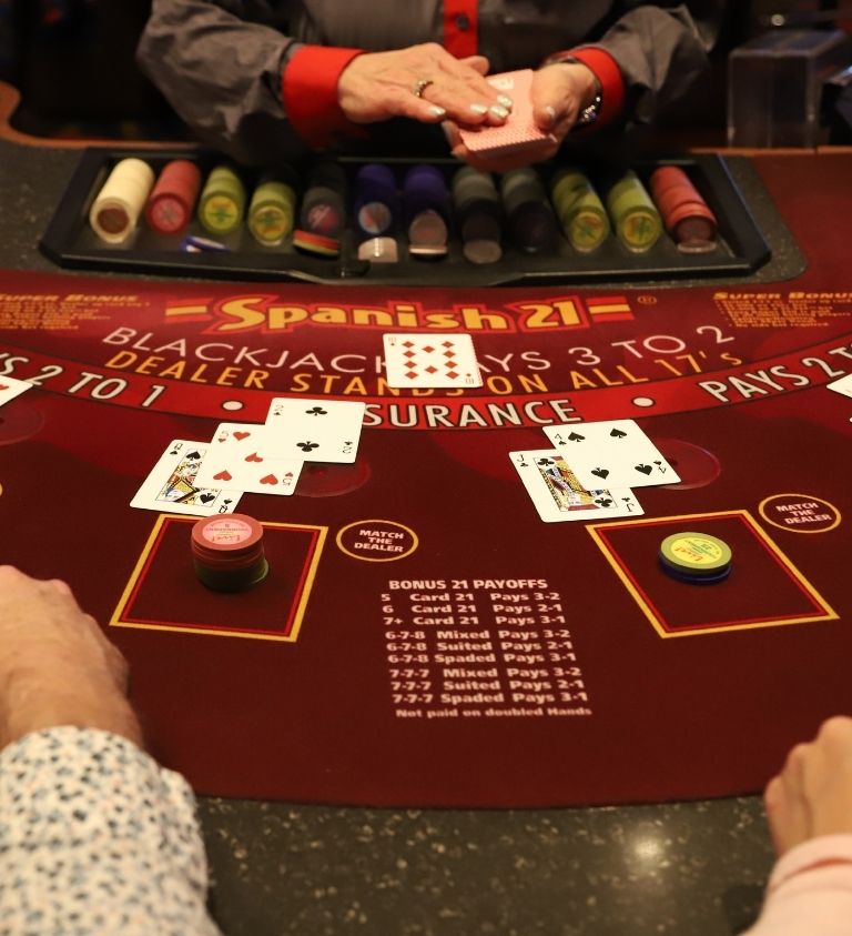 Guests playing Spanish 21 at Live! Casino.