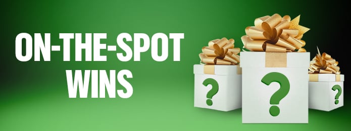 green background with mystery presents on the right side and text on the left side reading "on the spot wins"
