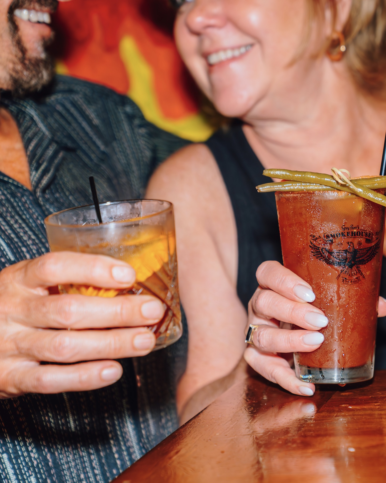 guests drinking cocktails at Guy Fieri's Smokehouse