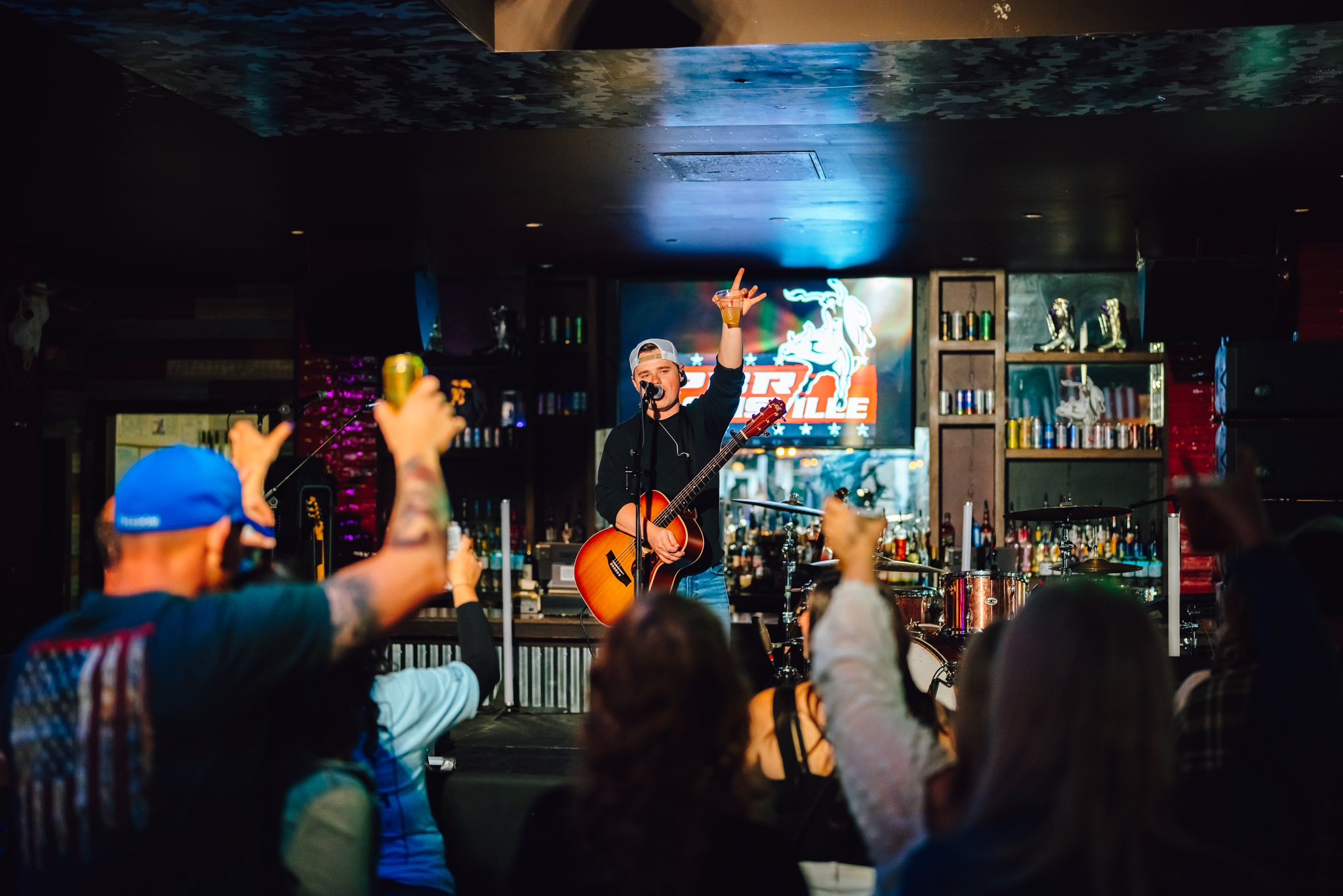 PBR concert with artist and crowd in background