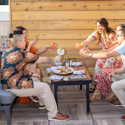 Friends socializing at AVA Rooftop.