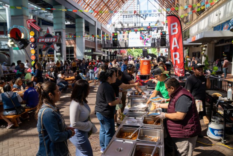 Hungry Cinco de Mayo celebrants line up for gourmet tacos at 4th Street Live!