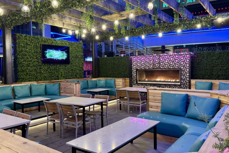 Besos y Abrazos outdoor patio lounge and fireplace.