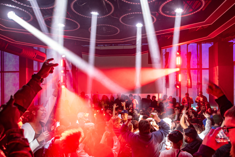 High-energy crowd on the dance floor at Mosiac night club and bar.