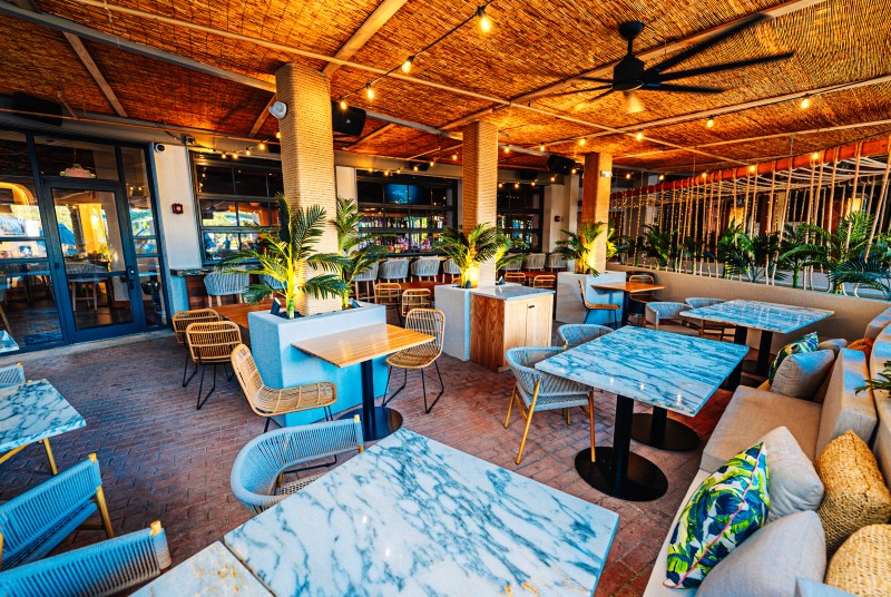 Patio dining at Palm Tree Club at Live! at the Pointe Orlando.