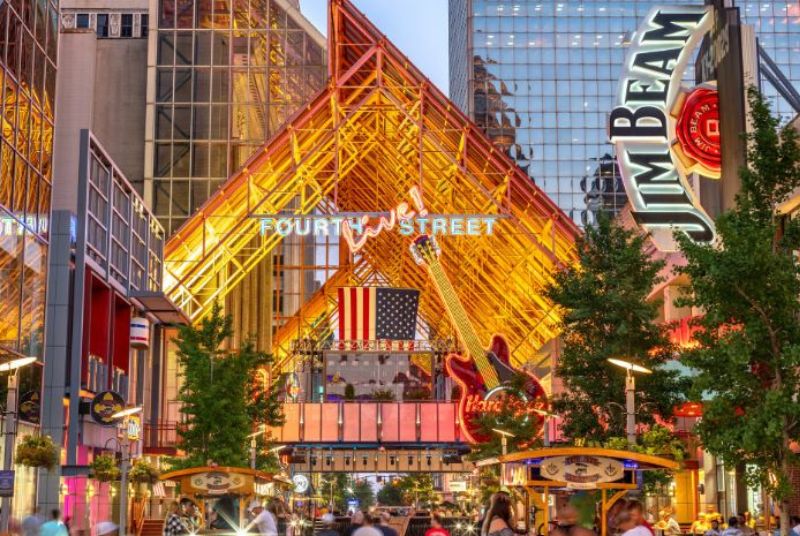 The view outside of Fourth Street Live! features a large Hard Rock guitar, a golden steel-beamed roof and a big American flag!