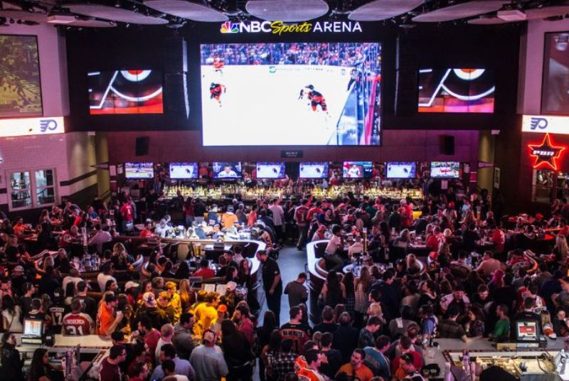Hundreds of Philadelphia Flyers fans watch their team on a 32-foot diagonal LED television at the NBC Sports Arena!