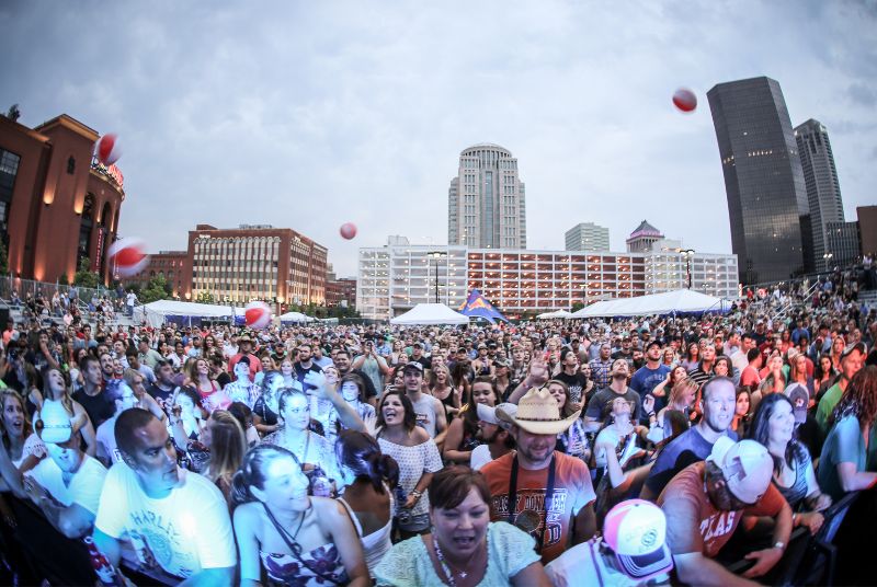 Beach balls bounce through a happy crowd of Downtown Hoedown concert-goers!