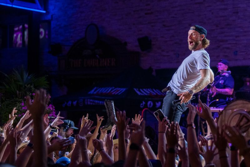 Chase Rice leans back with surprised look on his face as he looks at his Hot Country Nights audience! 
