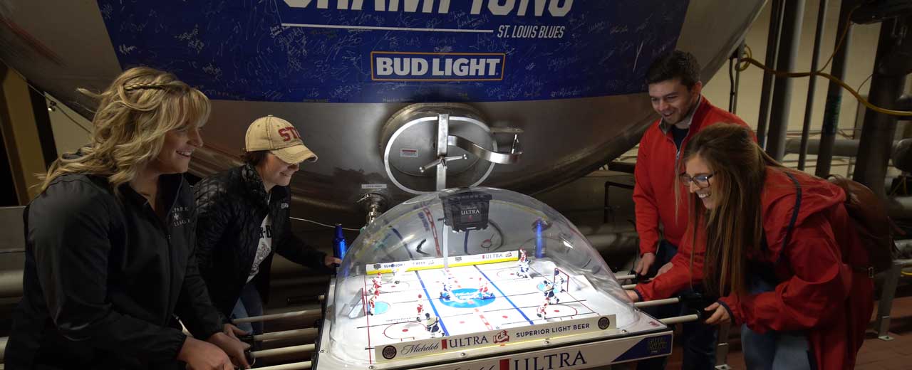 People playing Foosball in St. Louis