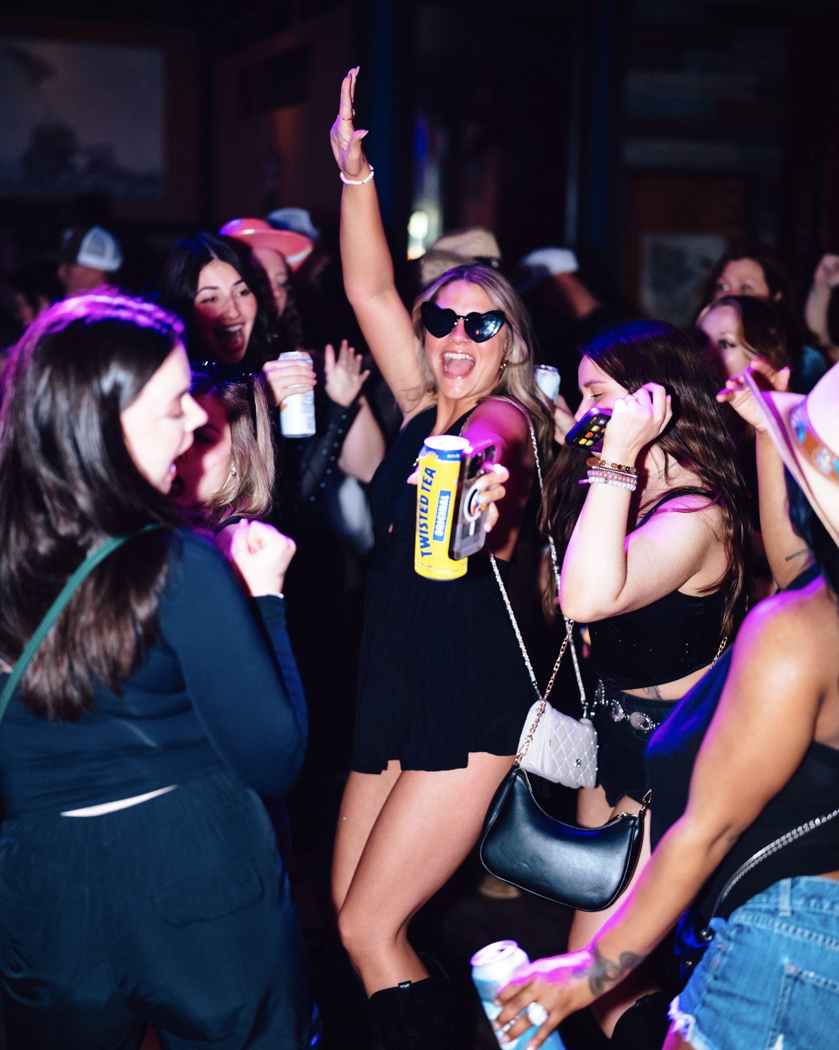 Girl dances on the floor at PBR Cowboy Bar
