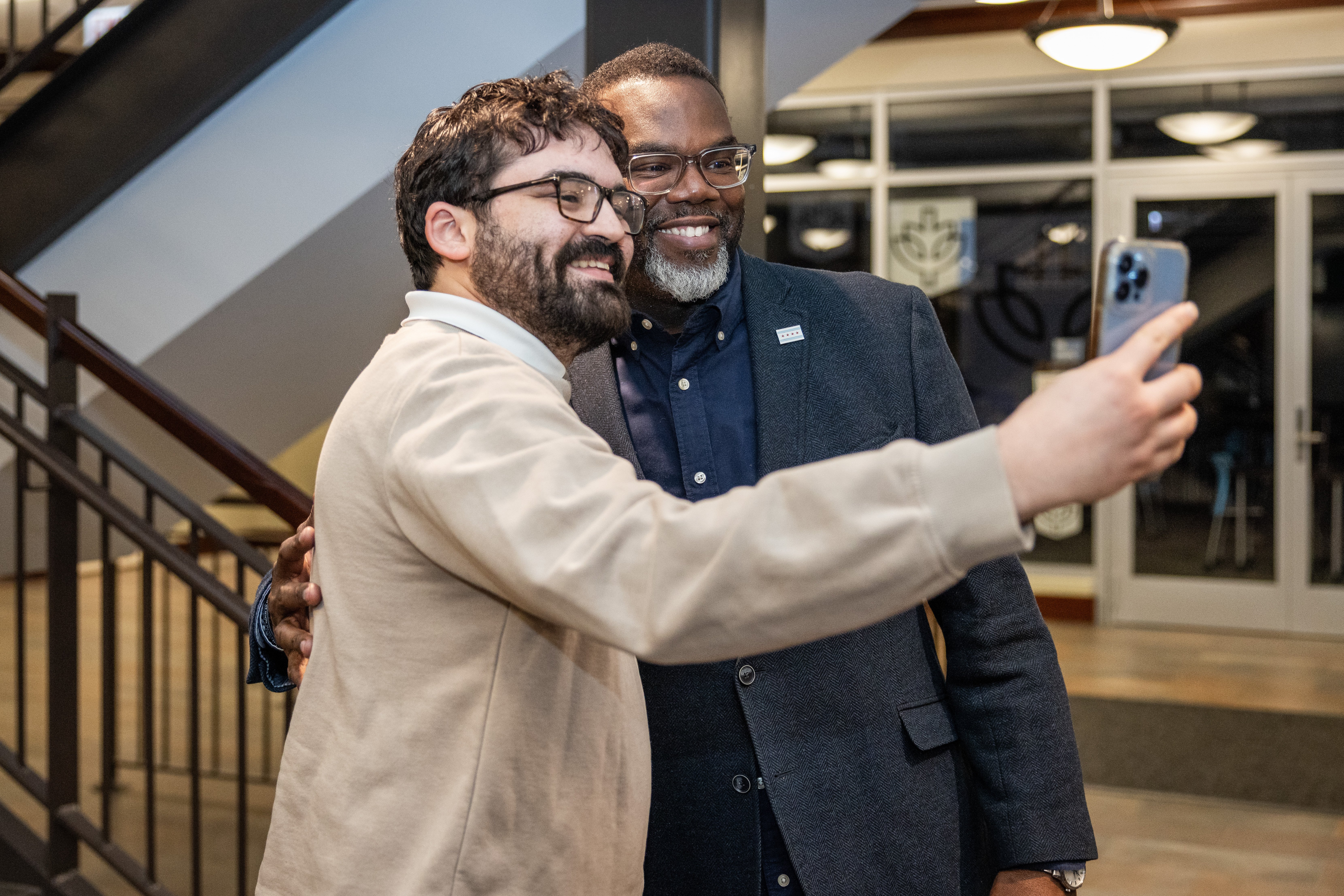 Chicago Mayor Brandon Johnson poses with a DePaul student after his Lakeside Chat series event on the Lincoln Park Campus.