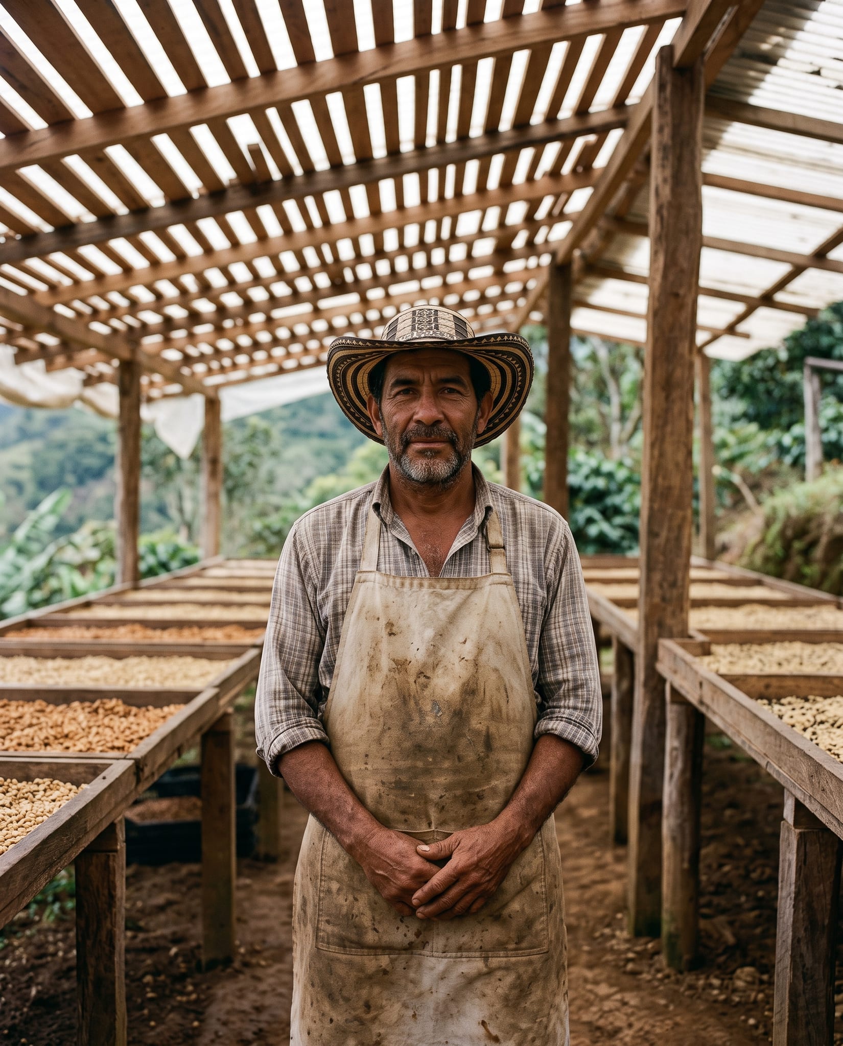 Nelson Ruiz under the shade-drying structure he built in Palestina, Huila