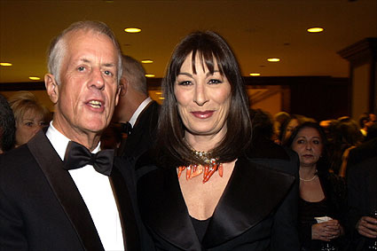 DGA President Apted with presenter Anjelica Huston.
