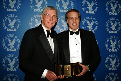 Robert Butler and Stephen Glanzrock show off the award to the press.