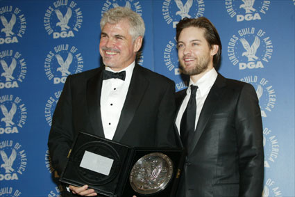 Ross and Maguire show off the medallion.