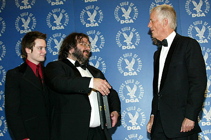 DGA President Michael Apted comes backstage to congratulate Jackson.
