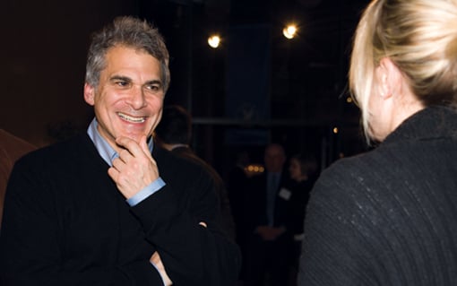 Nominee Lloyd Kramer chats with guests at the post symposium reception