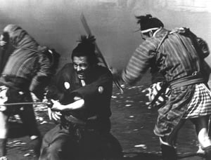  MIDDLEMEN: At the start of Yojimbo, Kurosawa frames an argument between father and son with Mifune placed strategically between them.” - photo courtesy Criterion Collection - click link for IMDB info.