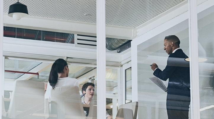 Alumni having a conversation in an office
