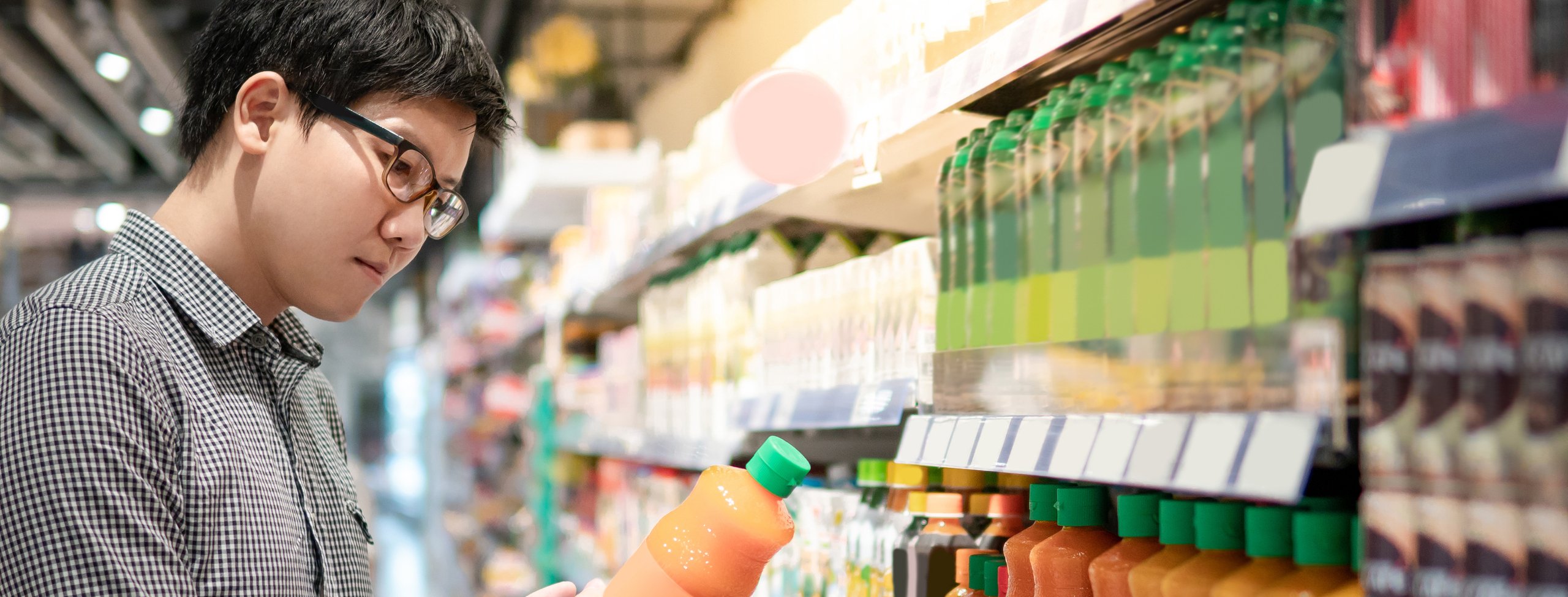 man choosing orange juice