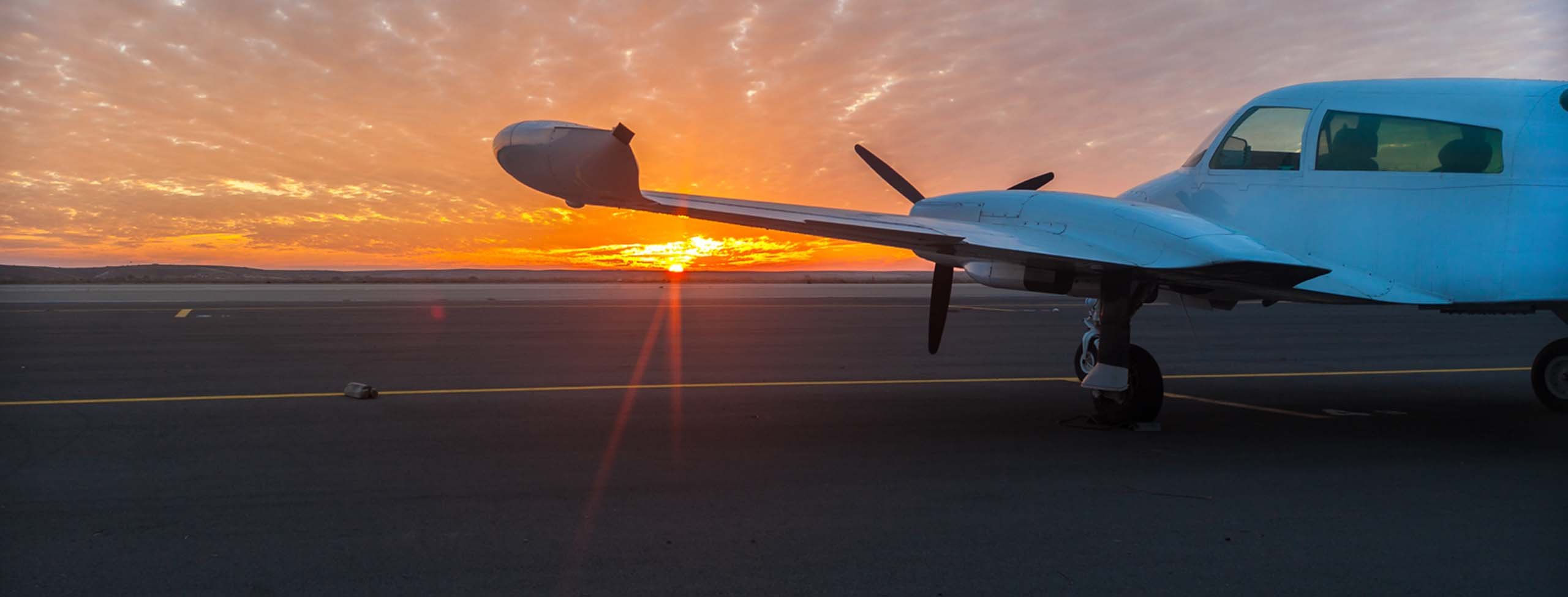 small plane at sunset
