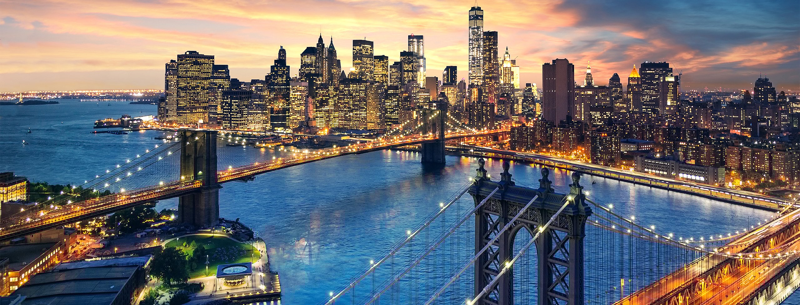 Manhattan and Brooklyn bridges at sunset