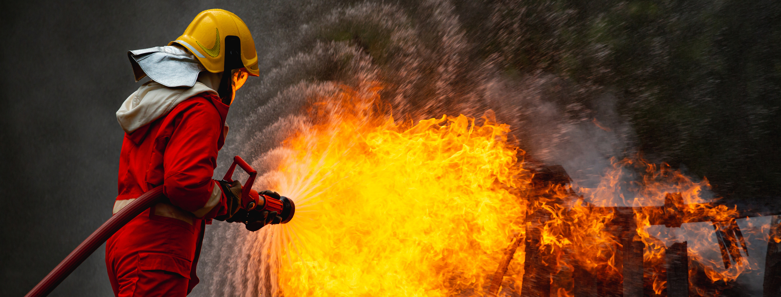 burning car and fireman