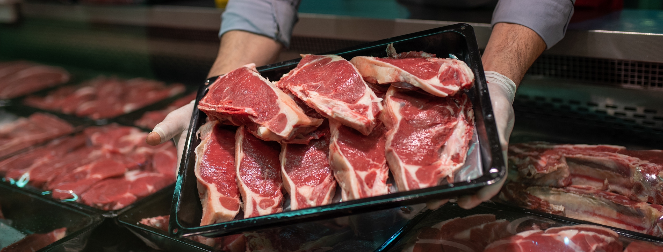 butcher holding meat