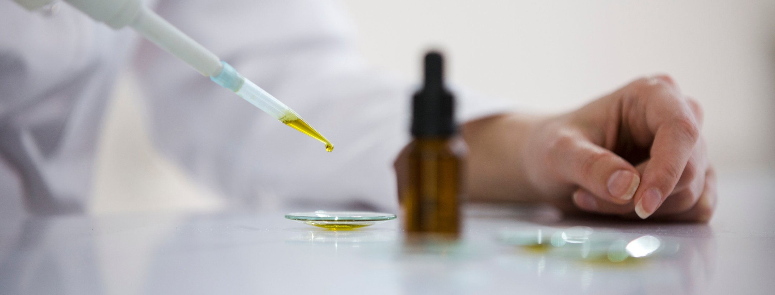 Doctor holding dropper