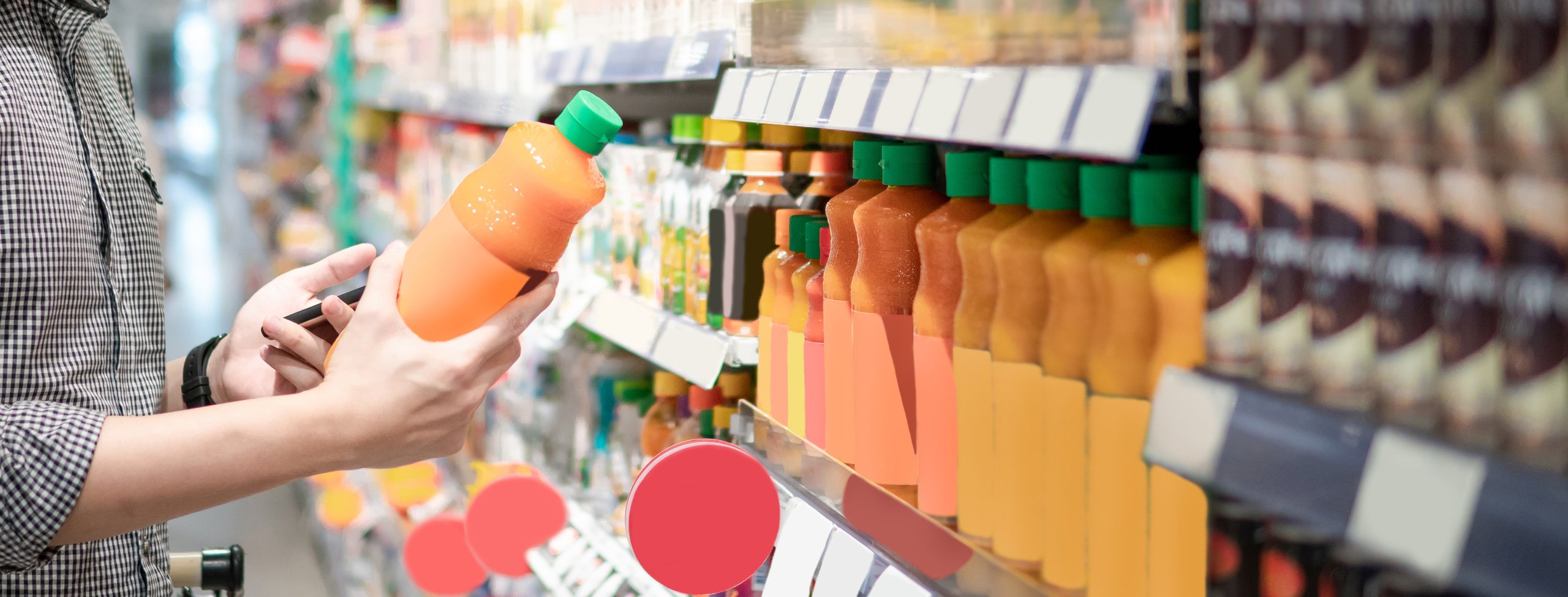 man choosing orange juice in supermarket