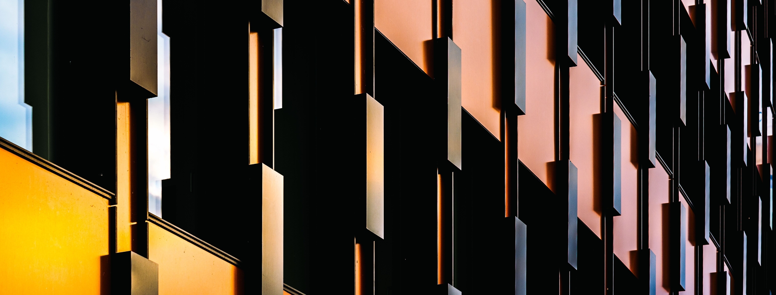 modern facade with geometric patterns and reflective windows