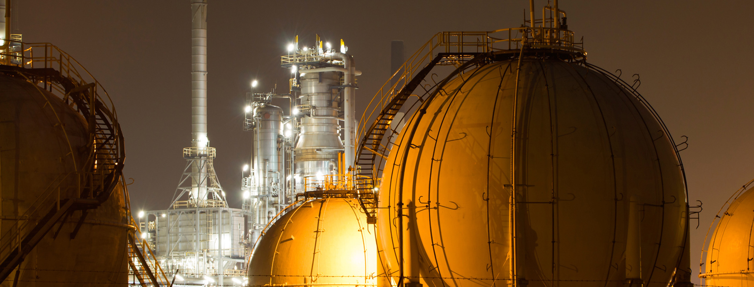 A large oil-refinery plant with Liquefied Natural Gas (LNG) storage tanks