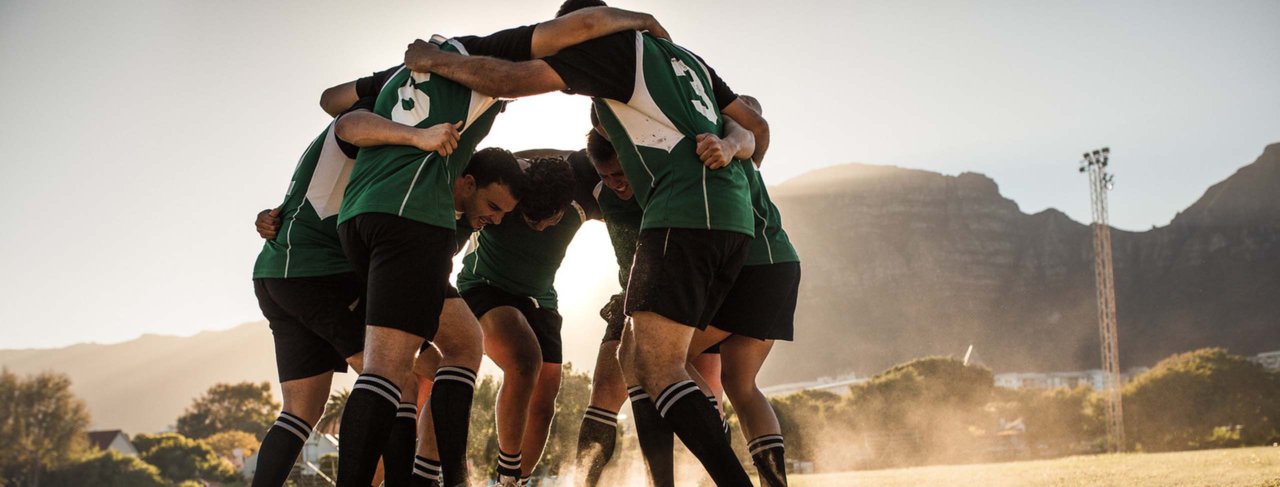 rugby players in a huddle