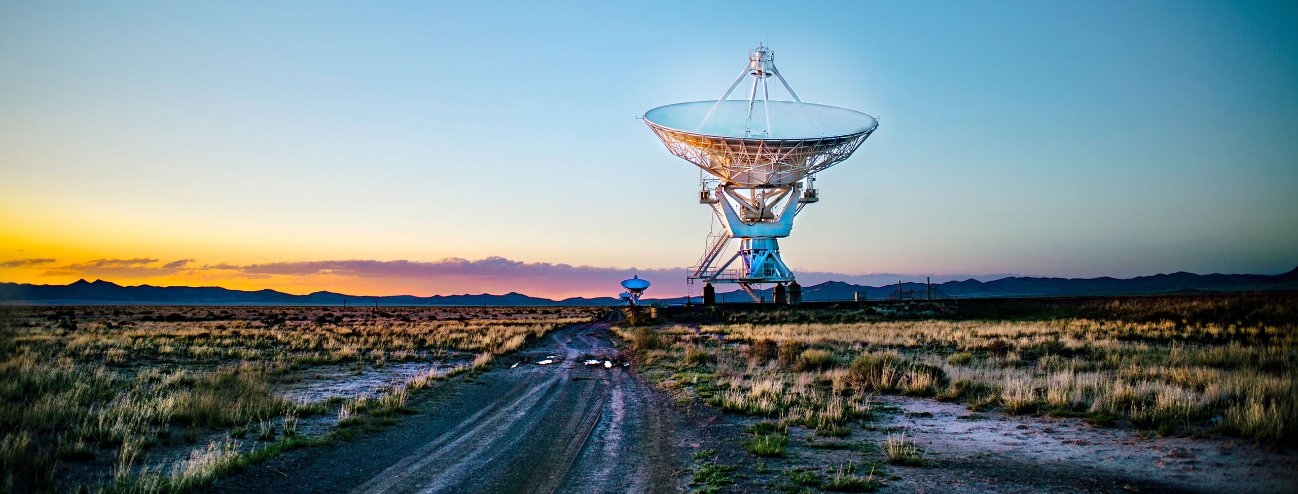 Satellite in front of sunset background