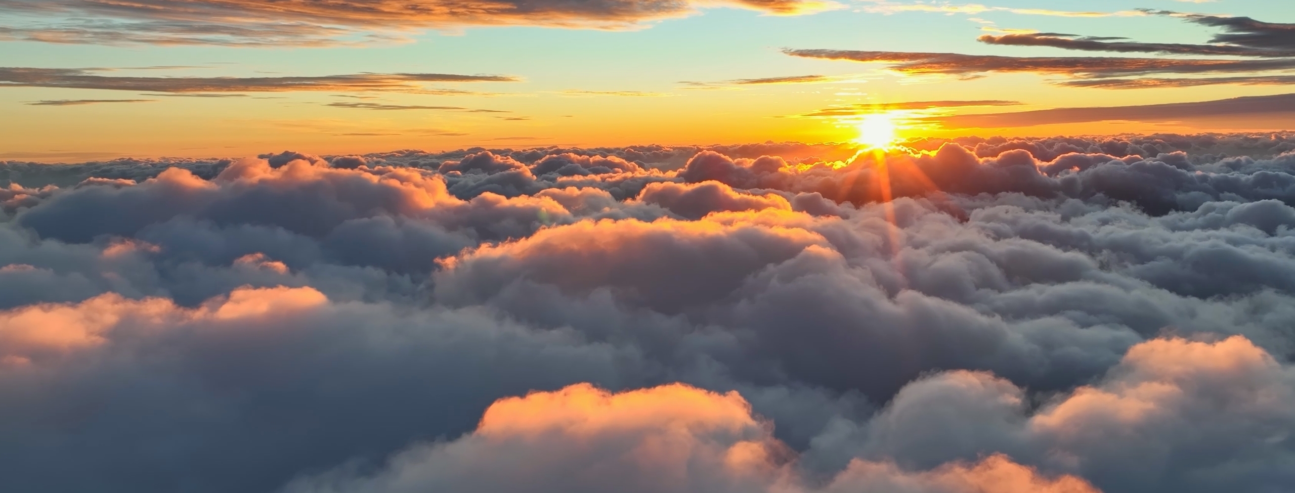 Sunset above the clouds