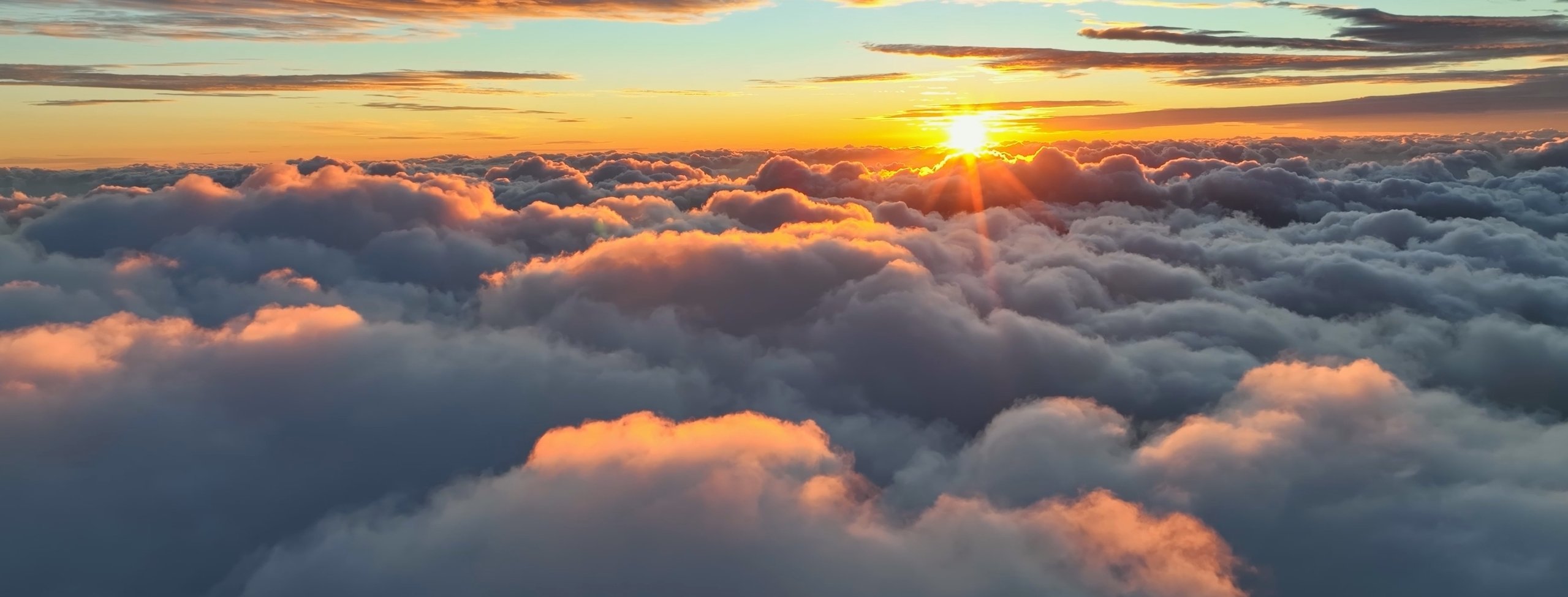 Sunset above the clouds