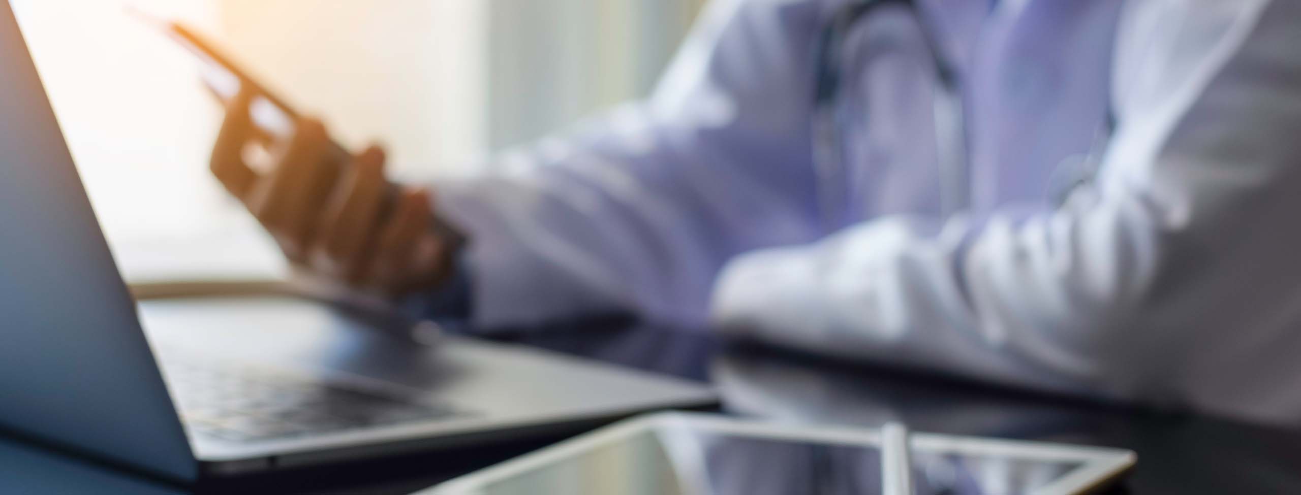 medical professional with laptop