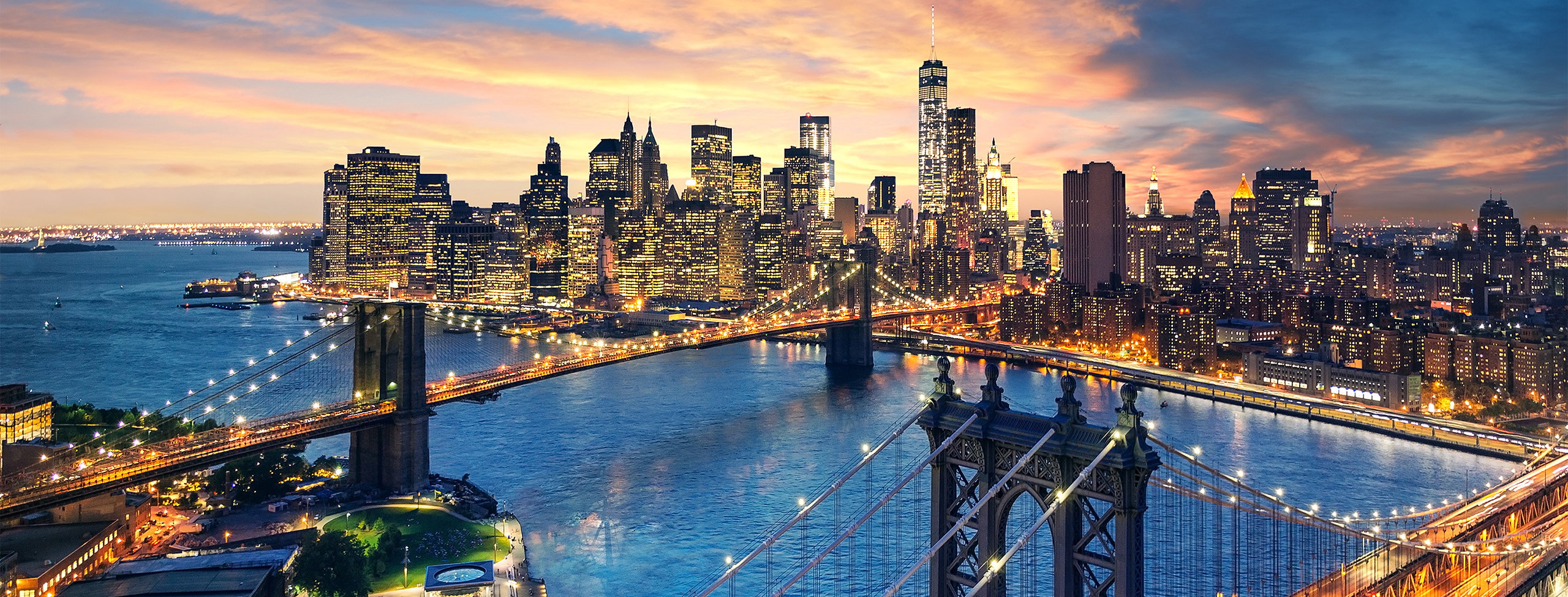 Manhattan and Brooklyn bridges at sunset