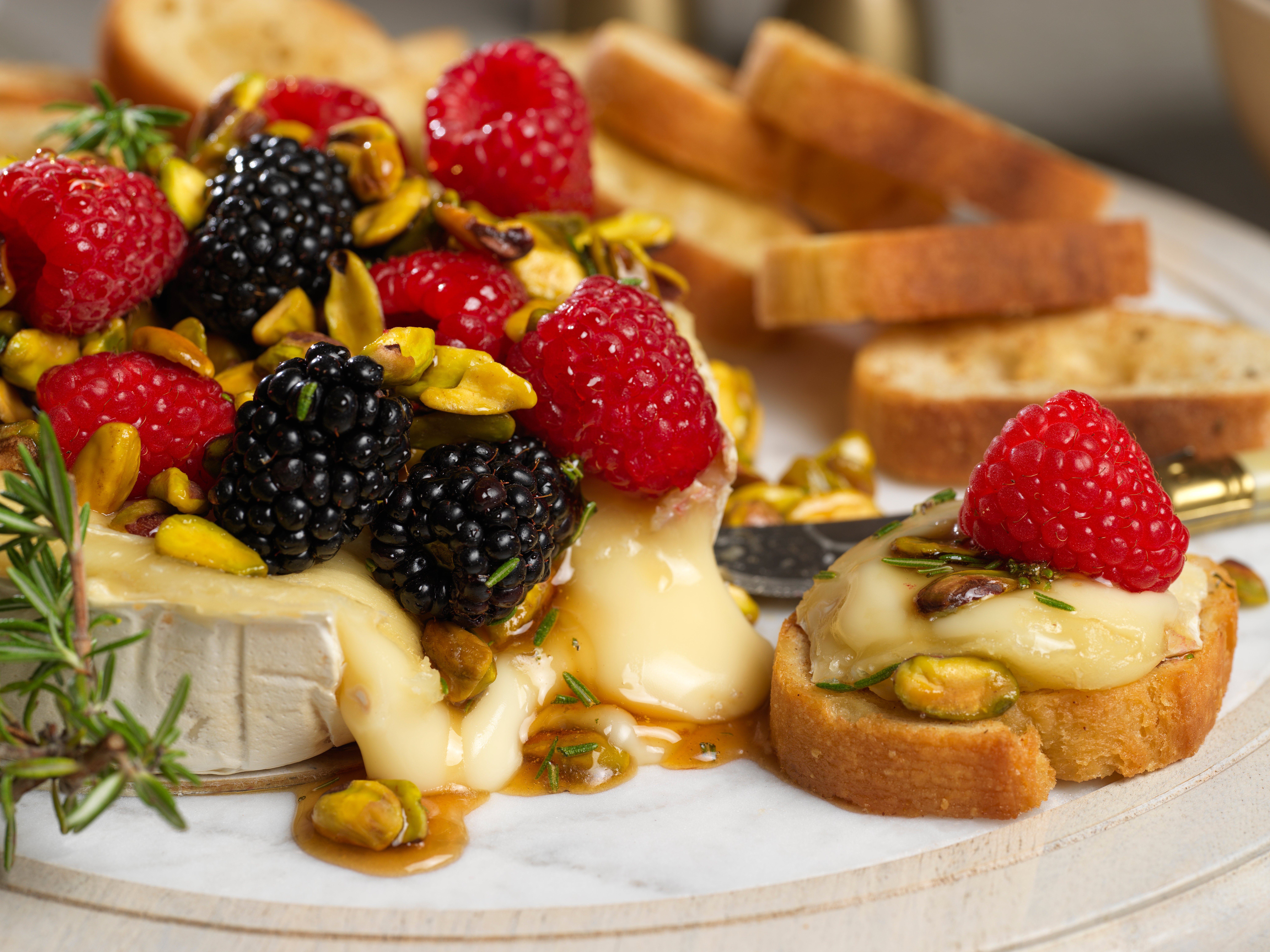 Baked Brie with Honeyed Raspberries and Pistachios | Driscoll’s