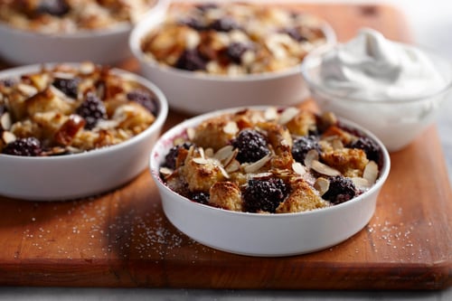 Cups of blackberry almond bread pudding