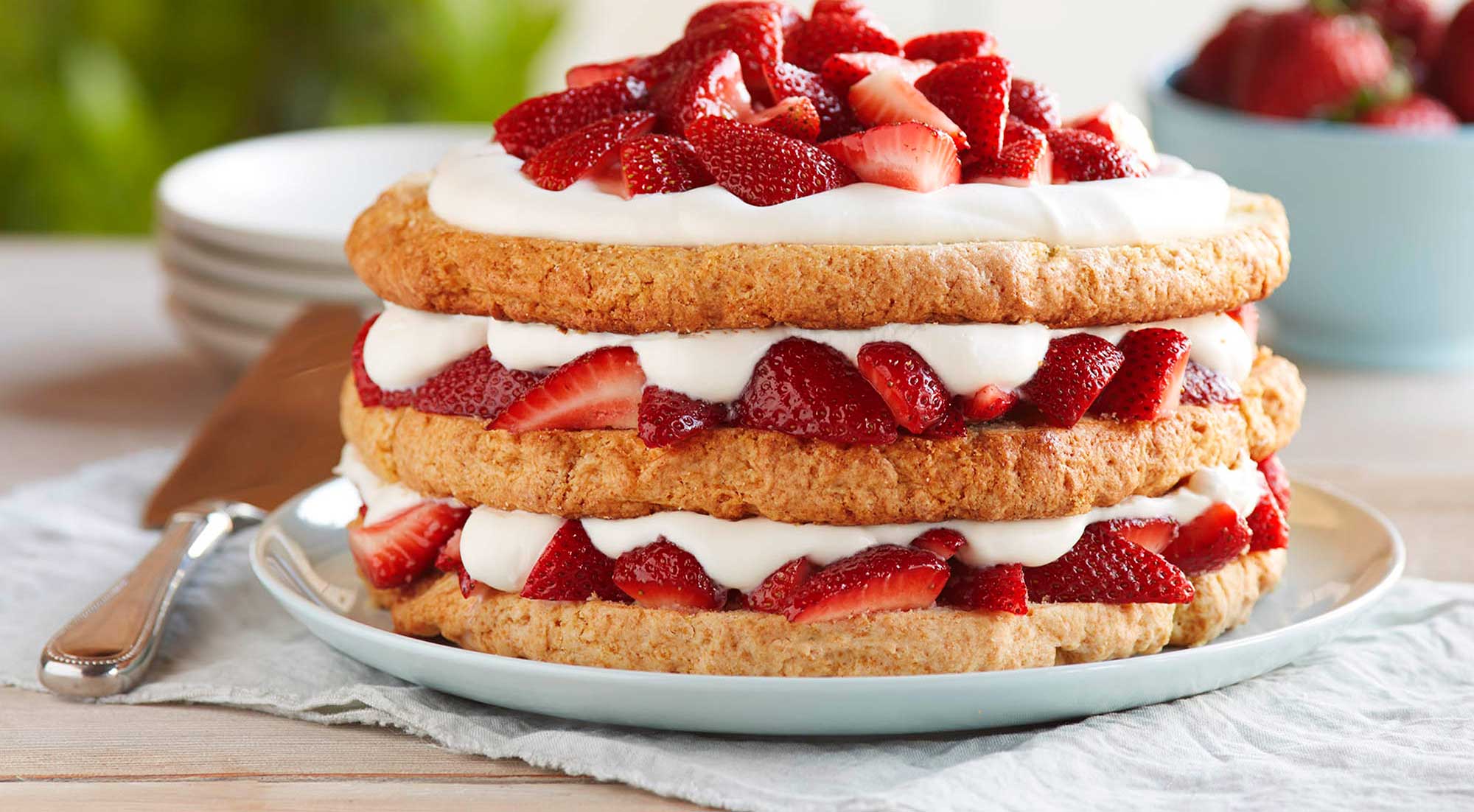 Strawberry shortcake piled with strawberries