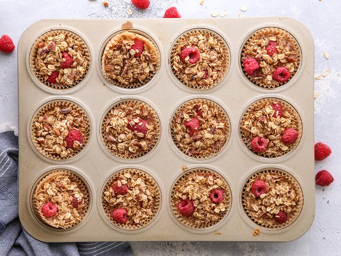 Raspberry Baked Oatmeal Cups in a muffin tin